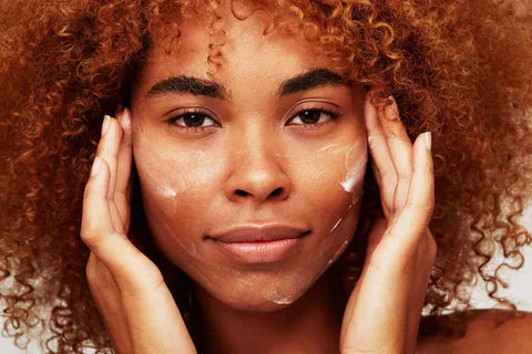 Woman applying vitamin C cream for radiant skin